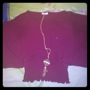 A burgundy butterfly type shirt